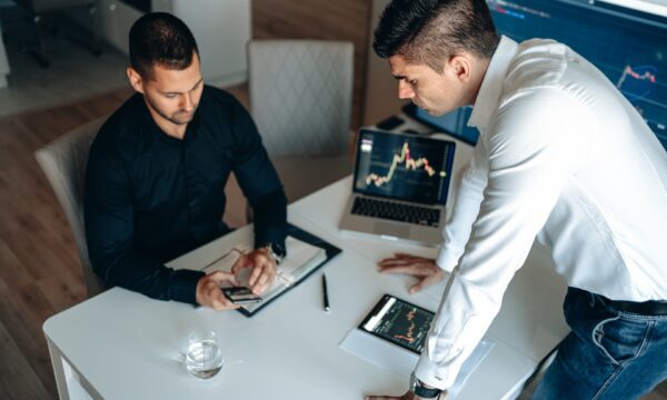 Men Checking Data on Stock Market